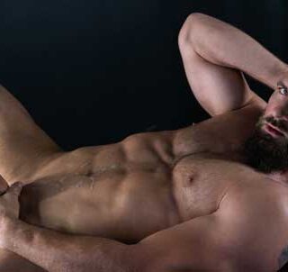 Bradley Virile is a bearded and hairy hunk of a man. Just as he tears open his undershirt, he can easily tear an ass in two. His bulging pecs, heavy cock, and Alpha attitude rival the manliest of men.