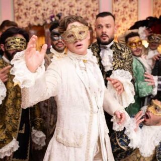 Cinderello arrives at the ball in a beautiful costume and fancy limo driven by his Fairy Godmother and catches the eye of the handsome Prince Cummings, putting a wrench in his Evil